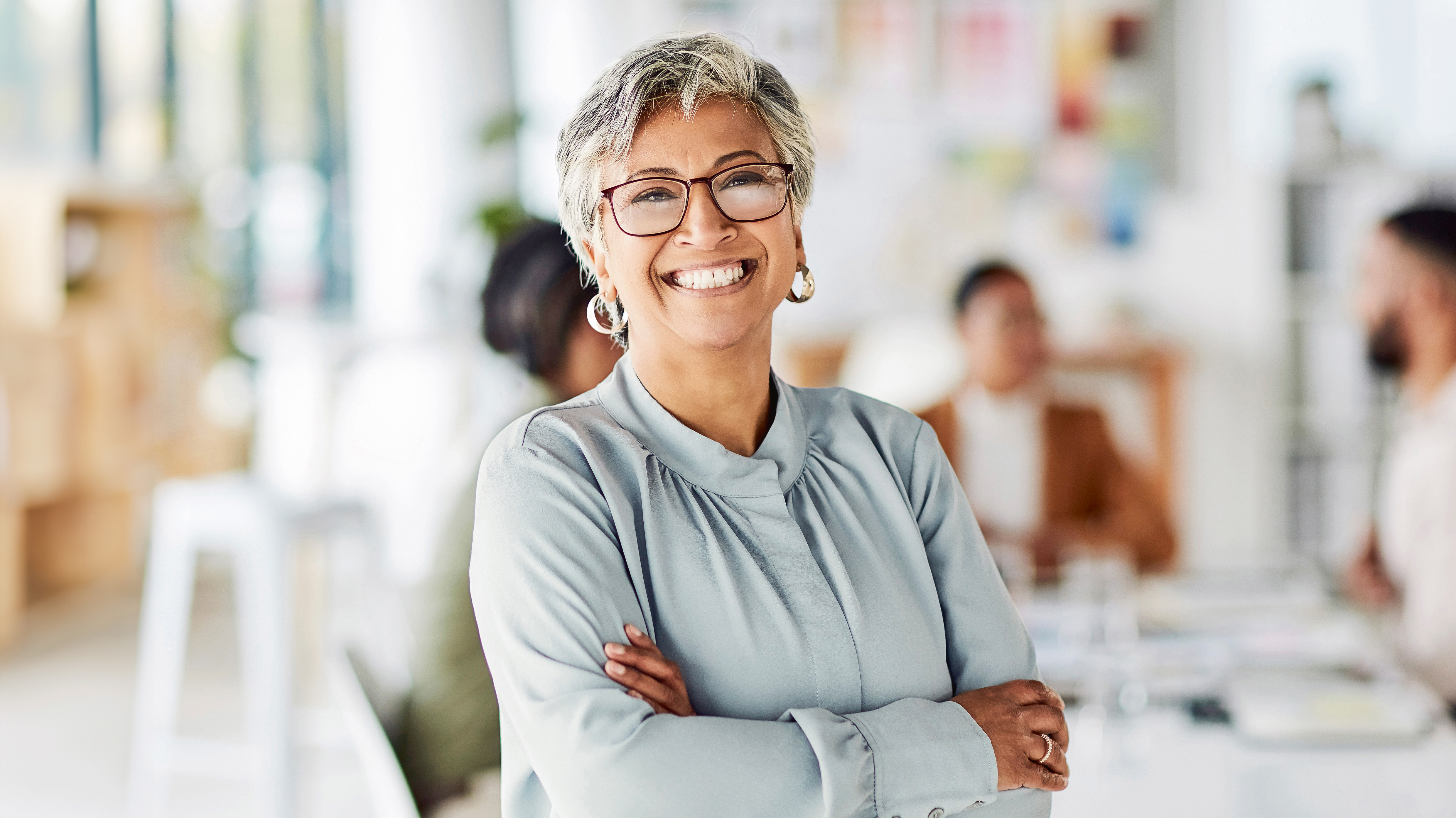 Woman hands folded looking at camera