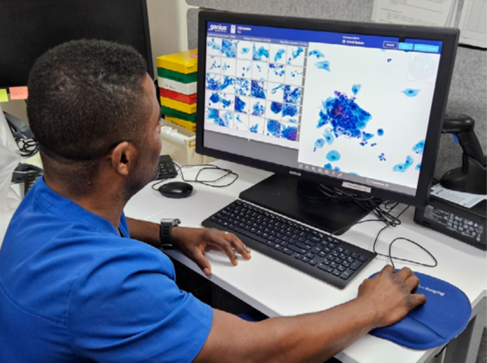 Emedi Babele, CT, uses a Hologic® Genius™ imaging system to view slides at P&C Labs.